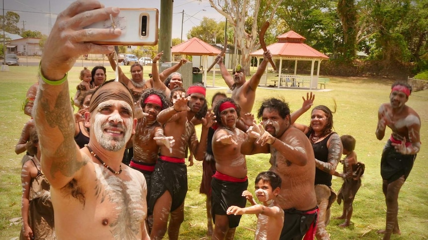 Wangan and Jagalingou in traditional dress take a selfie at a traditional ceremony in Clermont.