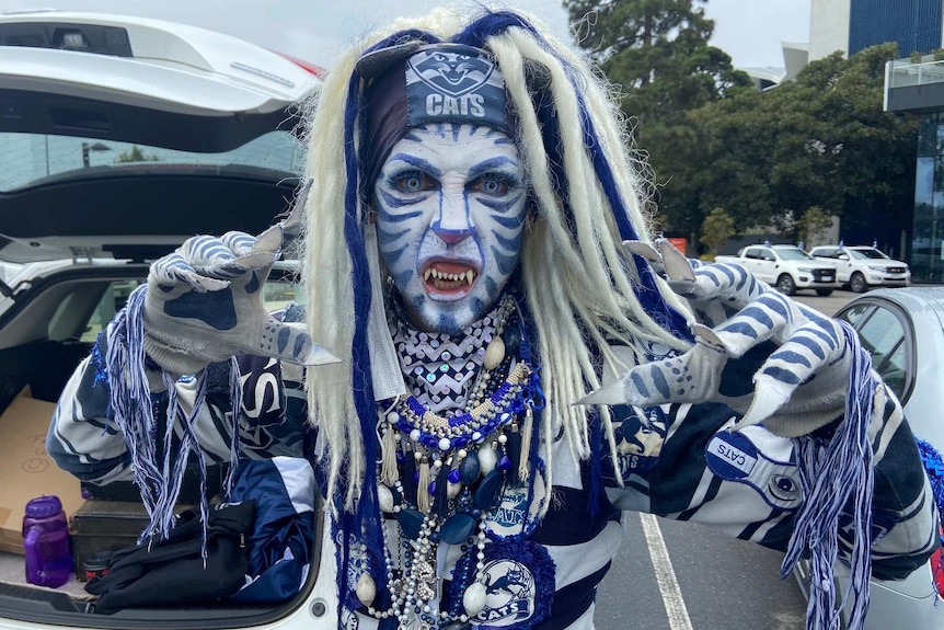 A man in heavily Cats-themed blue and white make-up and costume.