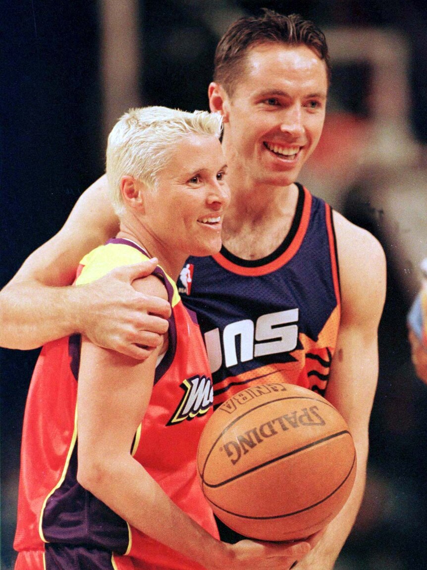 Michele Timms is embraced by Steve Nash of the NBA's Phoenix Suns.