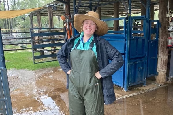 Vet nurse Gemma Lees smiles outside stables