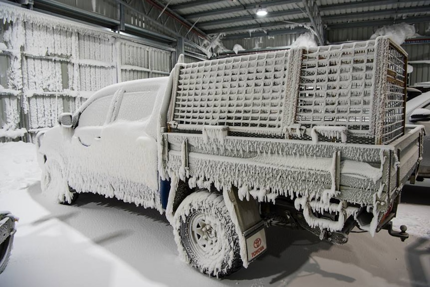 Snow covered vehicle at Davis research station, Antarctica.