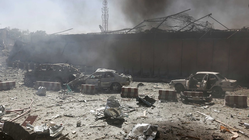 Damaged cars are seen after a blast at the site of the incident in Kabul, Afghanistan May 31, 2017.