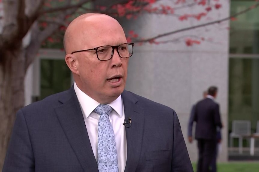 Peter Dutton speaks to someone off camera during a television interview.