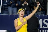 Elina Svitolina gestures to the crowd after her win in Monterrey