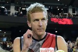 Milestone man ... Dustin Fletcher and his family lead the Bombers out at the MCG