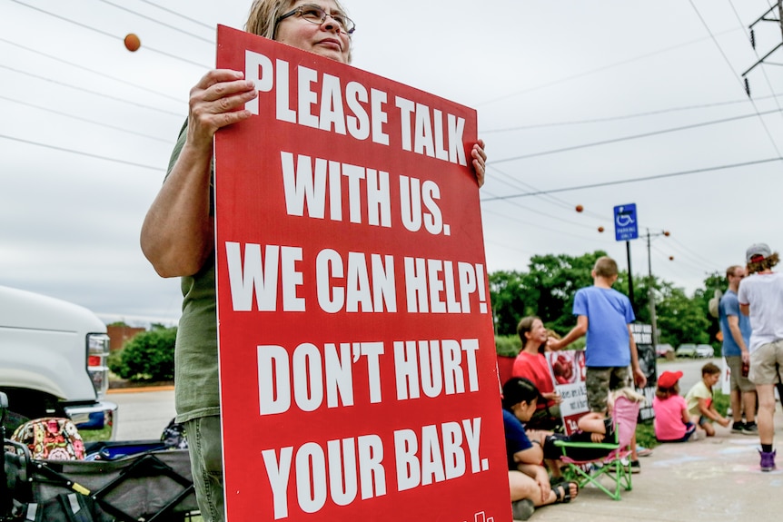 A protester with a sign.