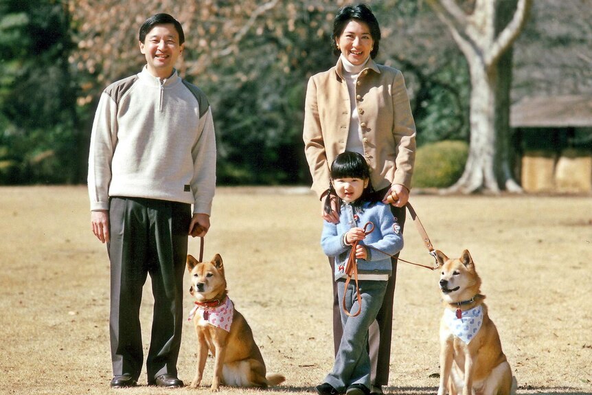 Crown Prince Naruhito with his wife, daughter and two dogs