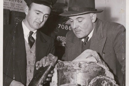 Two customs officers display their find.