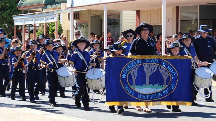 The Wooroolin State School bugle band plays in an Anzac Day parade.