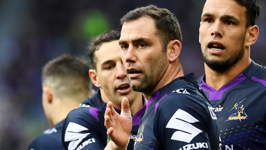 Billy Slater pats Cameron Smith on the chest