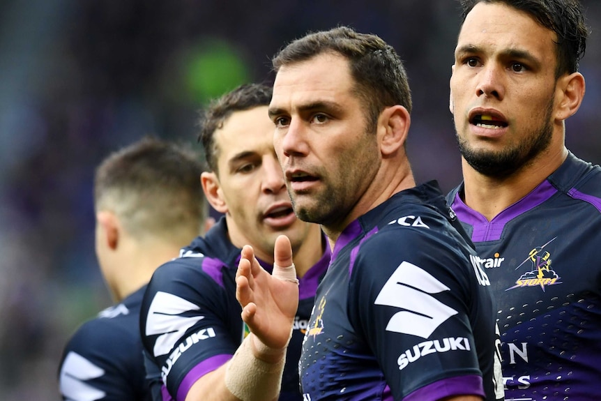 Billy Slater pats Cameron Smith on the chest