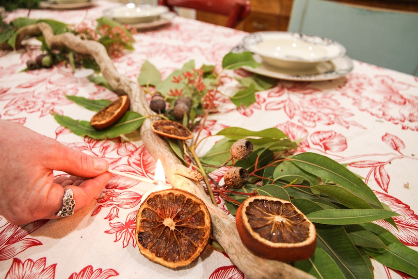 A Christmas table setting includes driedf ruit