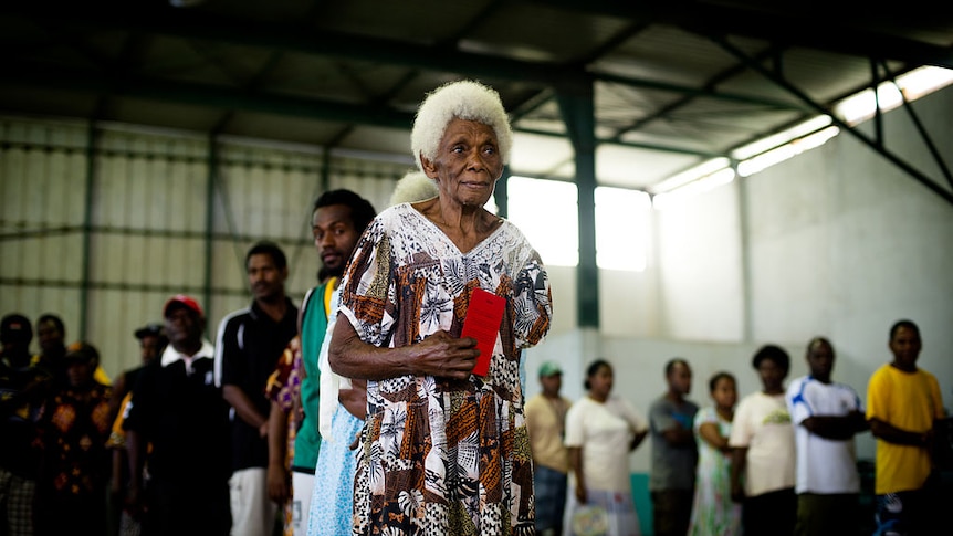 An elderly woman lines up to cast her vote in Vanuatu's 2012 election.