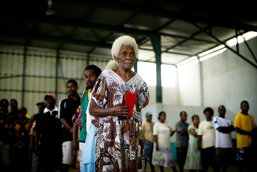 An elderly woman lines up to cast her vote in Vanuatu's 2012 election.