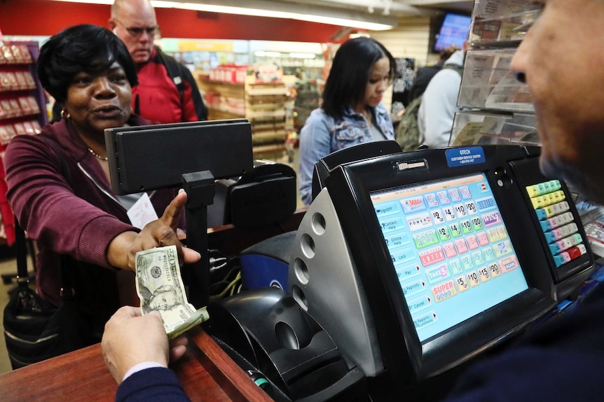 Annette Gray buys lottery tickets in New York.