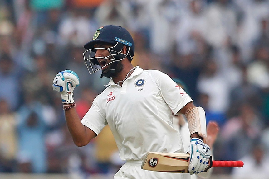 India's Cheteshwar Pujara celebrates a double century against Australia in the third Test at Ranchi.