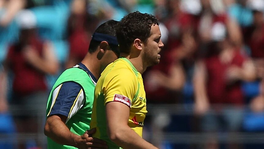 Game over ... Luke Morahan leaves the field injured against Tonga.