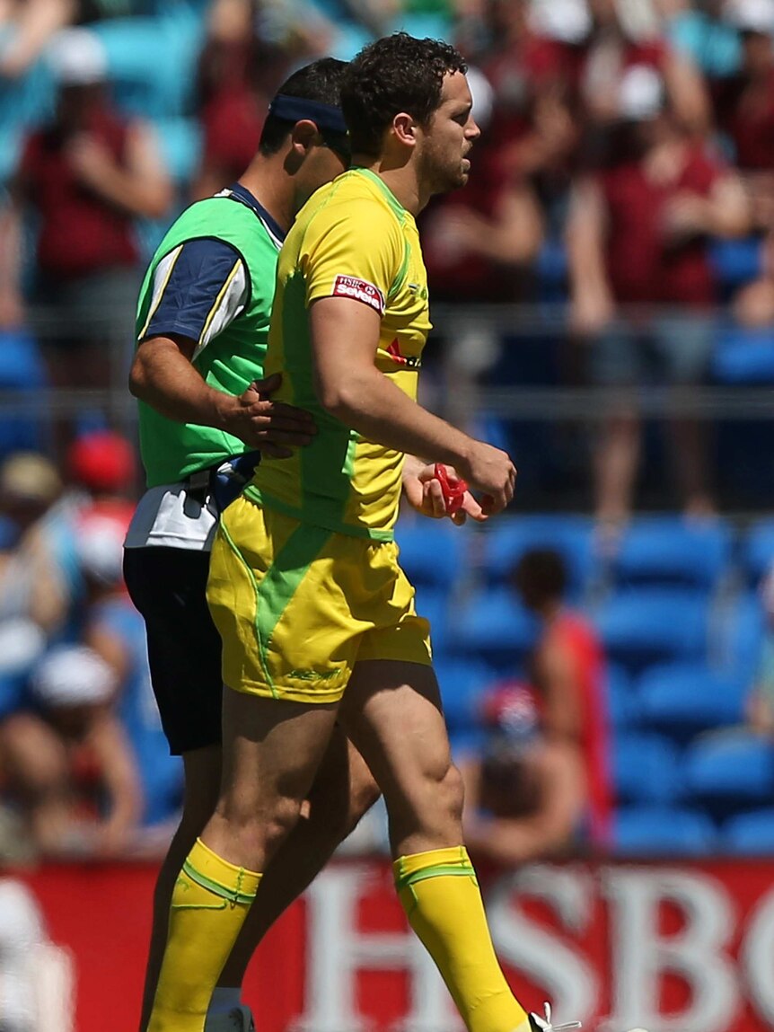 Game over ... Luke Morahan leaves the field injured against Tonga.