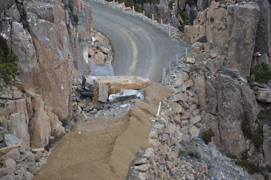 A large rock dislodged by authorities comes to rest on Jacobs Ladder