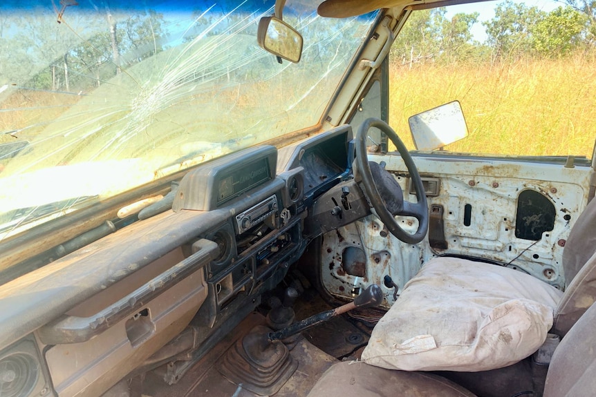 Inside an abandoned vehicle in the middle of nowhere.