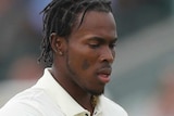 Jofra Archer throws a cricket ball up to himself