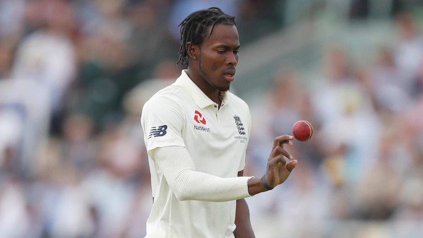 Jofra Archer throws a cricket ball up to himself