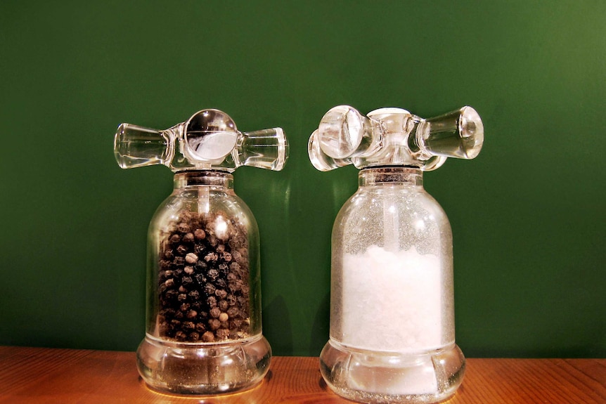 Salt and pepper shakers on a table.