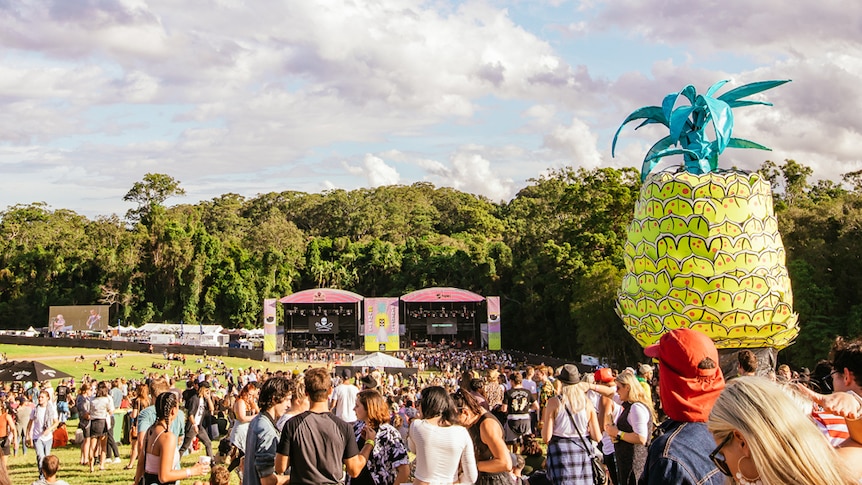 A shot of the Big Pineapple Music Festival main stage with a giant inflatable Pineapple in the crowd