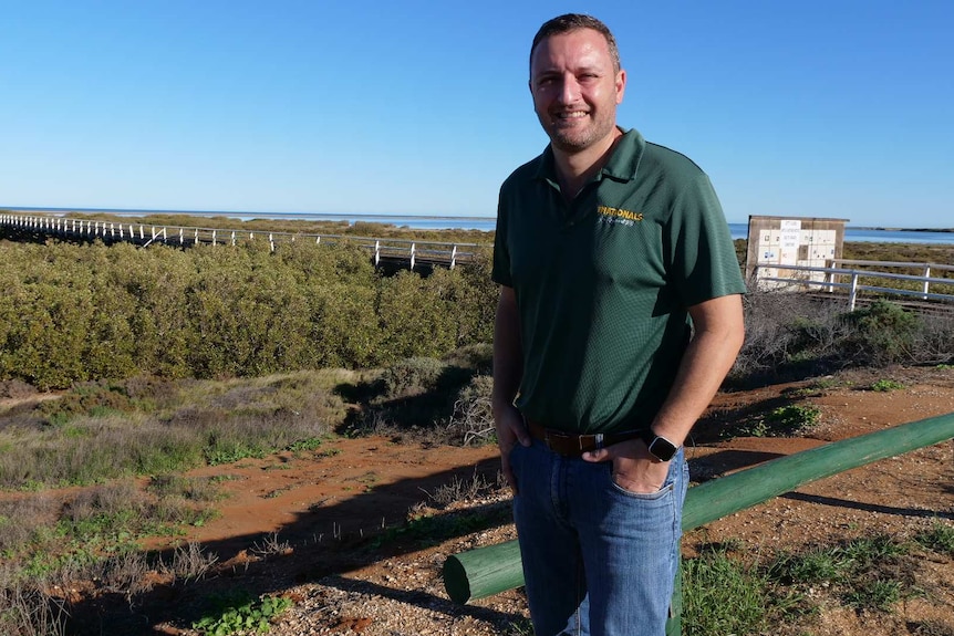 Man standing in front of Carnarvon's One Mile Jetty