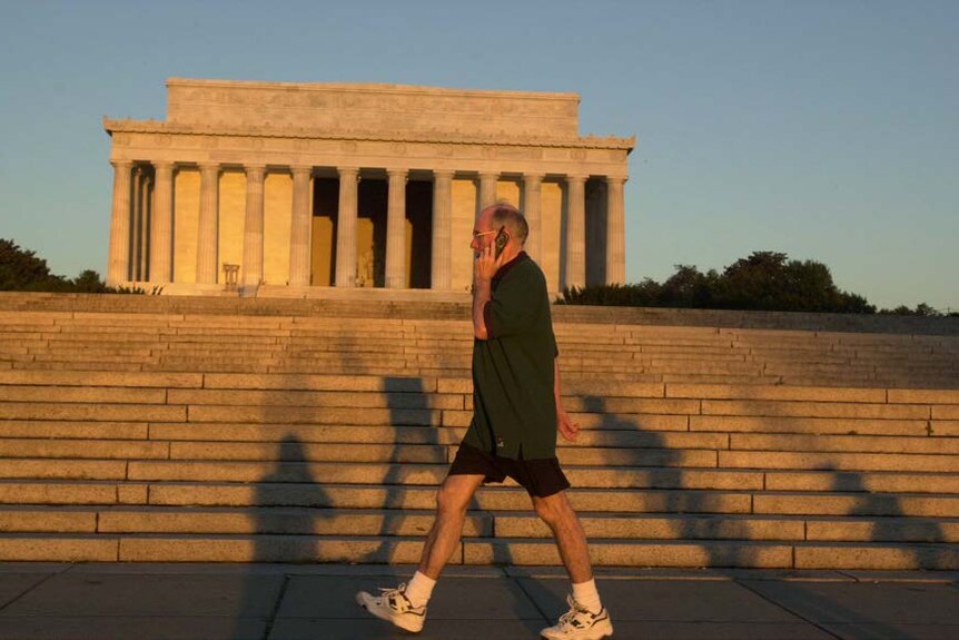 John Howard walks past the Lincoln Memorial