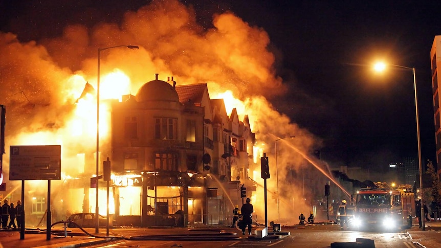 Firemen battle blaze during riots in Croydon, south London