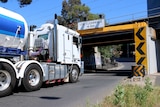A truck heads under a bridge at Napier Street Footscray.