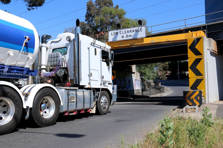 A truck heads under a bridge at Napier Street Footscray.