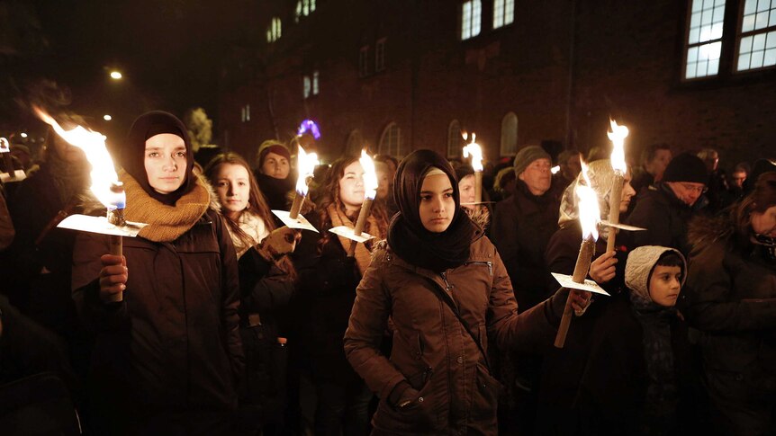 Thousands rally in Cophenhagen to pay tribute to shooting victims