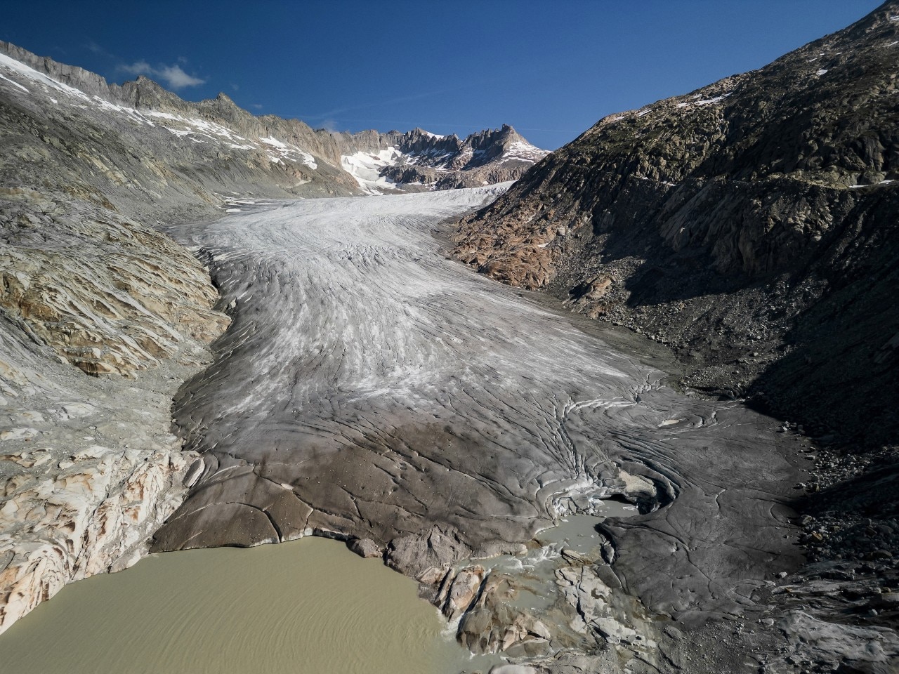 A landscape of rock, water and ice, seen from a distance.