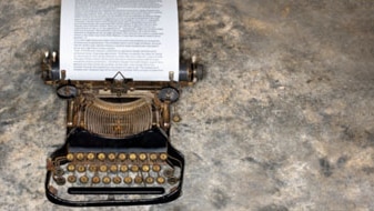 Antique typewriter with page of text (Thinkstock: Comstock)