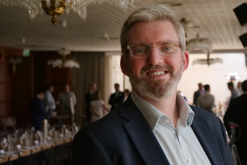 man with glasses and beard smiling