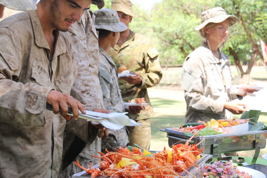 Soldiers feast after returning