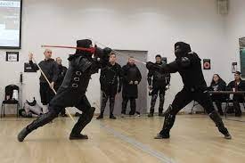 players battling it out with swords during a tournament