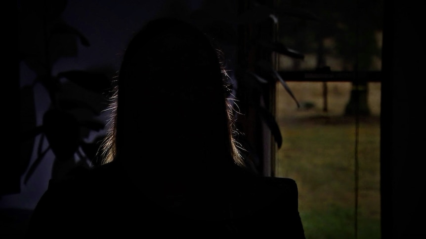 A silhouette of a woman's head.