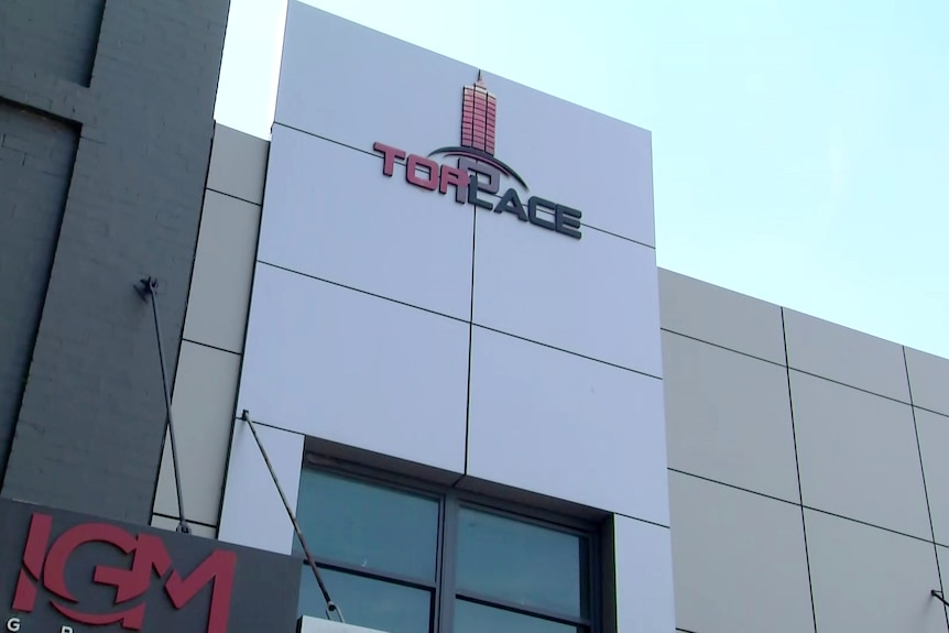 Toplace logo outside a building