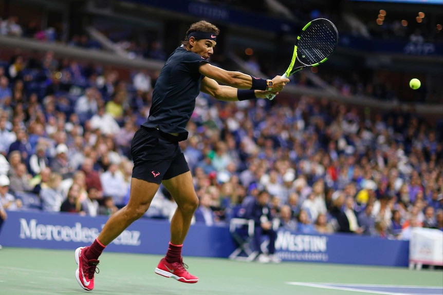 Rafael Nadal plays a double-handed backhand from near the baseline against Juan Martin del Potro at the US Open.