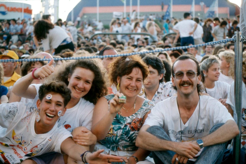 Four people smile for the camera on the last day of Expo 88 in Brisbane in 1988.