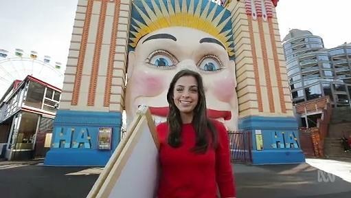 Woman stands outside Lunar Park entrance