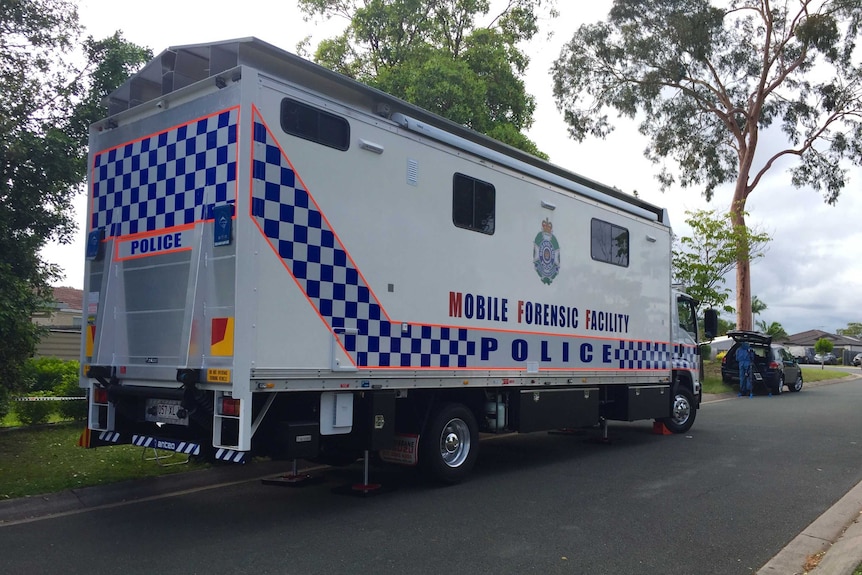 Forensic truck and police outside a house at Melnik Drive at Loganlea, south of Brisbane.