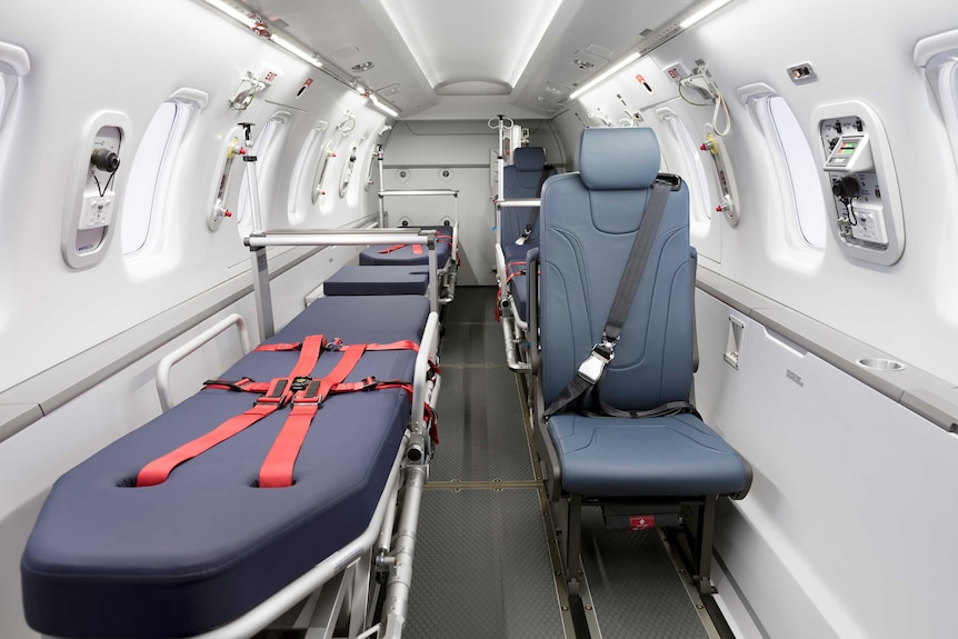 The inside of the RFDS jet, with three stretchers and seats for two medical teams.