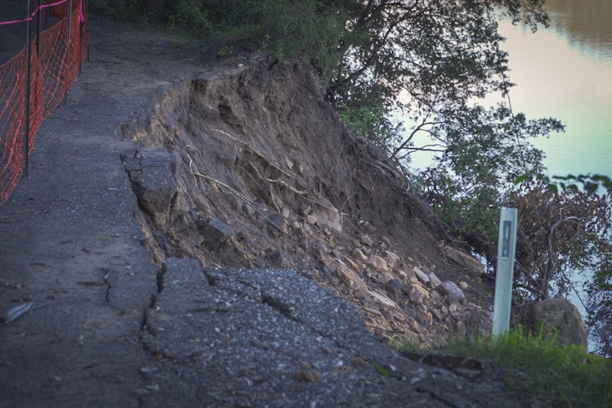 A damaged road that has slid into a river