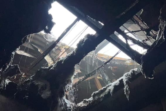 A fire-damaged ceiling