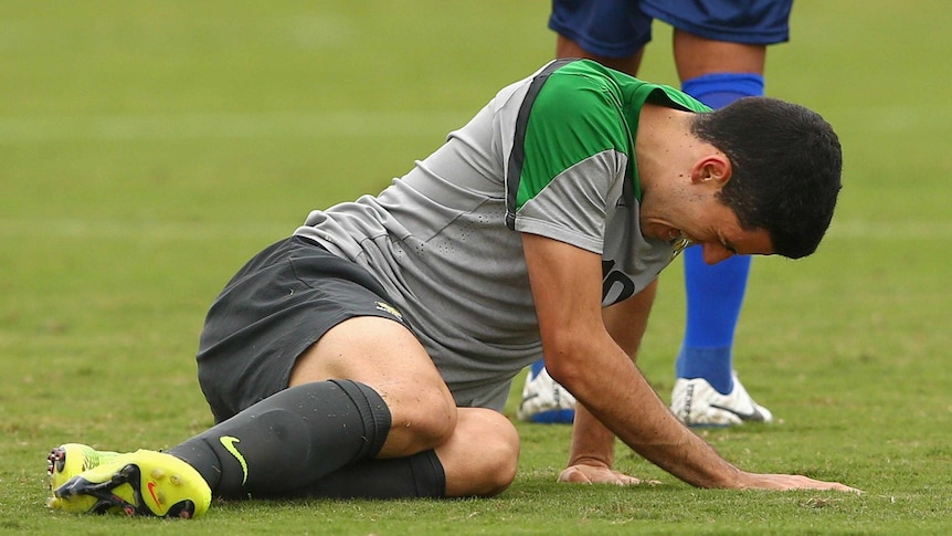 Tom Rogic of the Socceroos falls to the ground during a training match against Parana Clube.