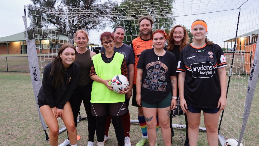 A womens soccer team and their coach.